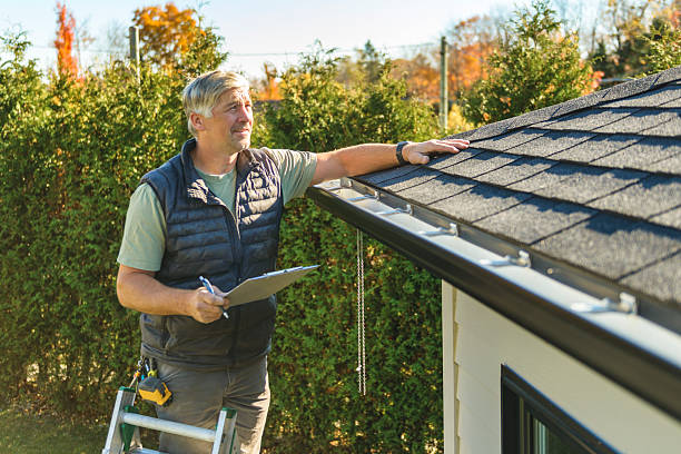 Professional Hail Damage Roof Repair technician working in Phoenix, IL